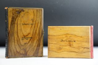 Two early 20th century olive wood books from Jerusalem to include a bible and pressed flowers from