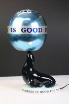 Advertising - A Carlton Ware 'Guinness Is Good For You' sealion lamp with revolving metal shade,