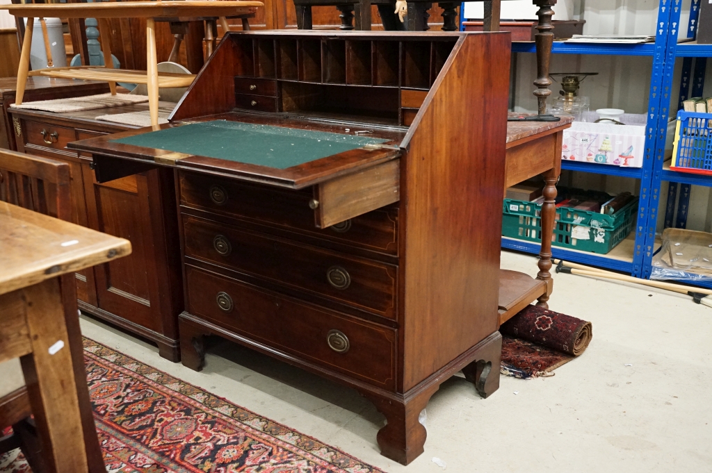 19th century Mahogany Inlaid and Cross-banded Bureau, the fall front opening to a fitted interior,