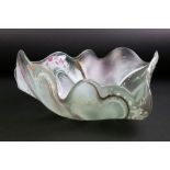 Contemporary studio art glass dish of organic shell-like form, with ribboned & flecked decoration,
