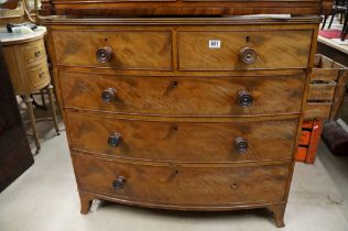 Early 19th century Mahogany Bow Front Chest of Two Short over Three Long Drawers raised on swept