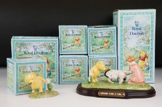 Seven Royal Doulton Winnie the Pooh collection ceramic figurines, all in their original boxes.