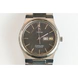 A gents Omega Seamaster quartz wristwatch, black dial with day and date function to 3 o'clock,
