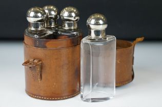 Early 20th century Set of Four Curved Glass Bottles with stoppers and Silver Plated Lids,