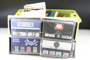 A large collection of stamps, first day covers and presentation packs contained within albums