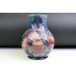 Moorcroft 'Pomegranate and Finches' pattern blue ground tube lined vase, of baluster form, after a