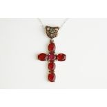 Silver Gilt Crucifix set with Garnet style stones and Emerald cabochons