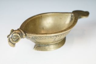 Indian cast brass kharal opium water drinking bowl of marquise shape having a rams head handle and