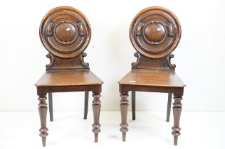 Pair of 19th century Mahogany Hall Chairs with moulded circular backs and solid seats, each 43cm