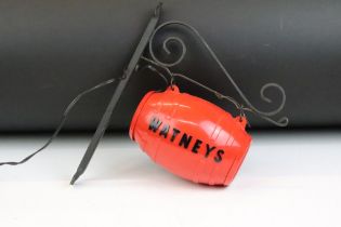 Advertising - A Watneys Ale bracket advertising light, with red plastic barrel and black