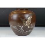 Japanese bronze ovoid vase, decorated with a phoenix perched amongst waves, with gilt & silvered