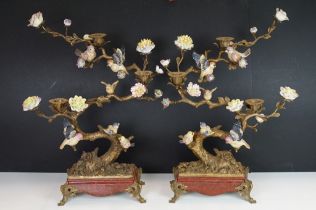 Pair of Wong Lee bronze three-light candelabra in the form of flowering trees, with ceramic birds