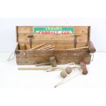 A wooden cased Jaques croquet set to include mallets, ball & hoops.