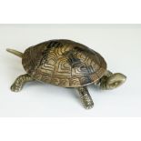 An early 20th century shop counter bell in the form of a Tortoise, wind up mechanism, marked GSS