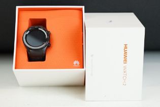 A Black Huawei Watch 2 smart watch on black sports strap, complete with original box.