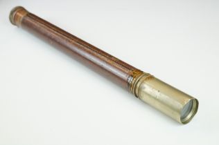 Leather bound single draw hand held telescope. Unmarked. Measures approx 60cm when extended.