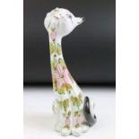 Mid 20th Century Italian pottery model of a seated cat, of elongated form, with pink floral