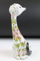 Mid 20th Century Italian pottery model of a seated cat, of elongated form, with pink floral