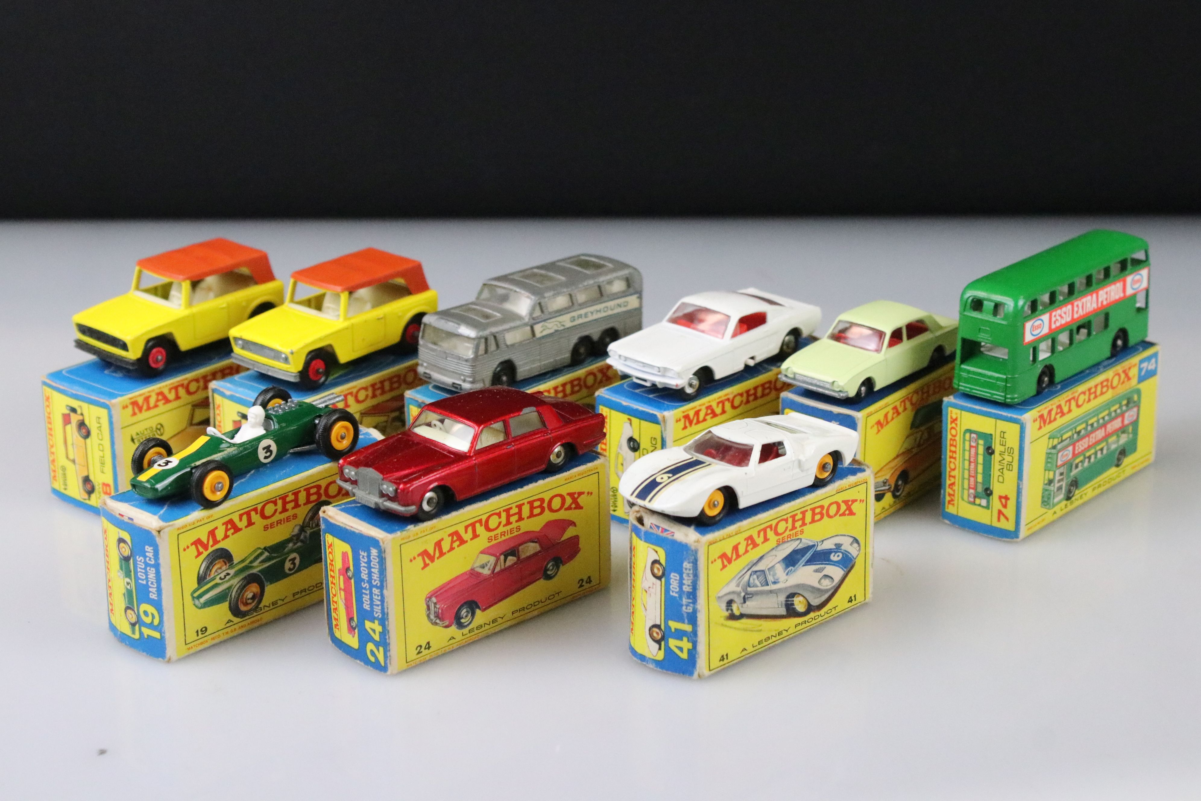 Nine boxed Matchbox 75 Series diecast models to include 18 Field Car, 19 Lotus Racing Car, 66