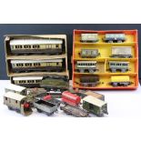 Around 20 early 20th C items of rolling stock to include Bing, Hornby and MLL featuring coaches,