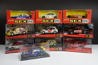 Nine boxed / cased SCX 1/32 Slot Cars to include 60460 Seat Cordoba, 62800 Ford MK II, 60580 Ford