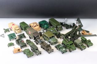 Around 25 mid 20th C play worn military diecast vehicles and artillery to include Britains, Lone