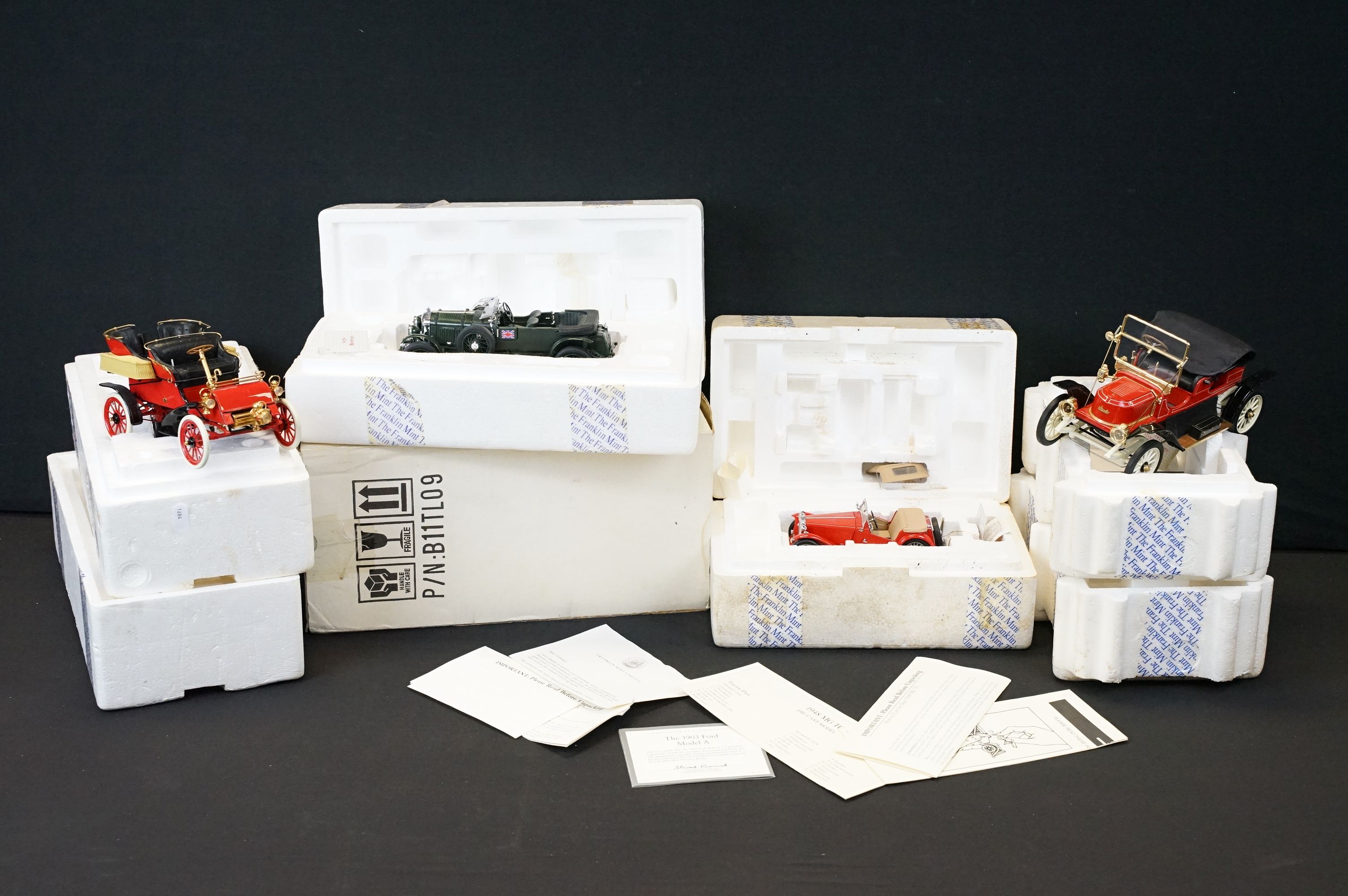 Four boxed Franklin Mint 1/24 diecast models to include 1948 MGTC, The 1903 Ford Model A, 1911