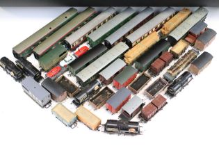 Over 50 OO gauge items of rolling stock to include wagons, coaches and vans featuring mainly kit