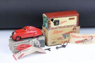 Boxed Schuco Command Car AD2000 clockwork model in red, with key and paperwork, plus a boxed