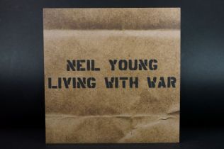 Vinyl - Neil Young Living With War on Reprise Records 44335-1 with booklet. Sleeve has small split