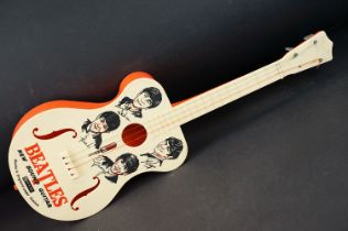 Memorabilia - A Selco Beatles guitar. Missing one tuning peg