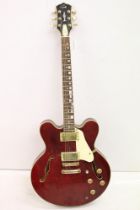 Guitar - A Gould GS135 hollow body electric guitar in wine red finish