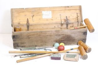 A Jaques & Sons lawn croquet set within wooden case.