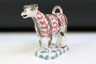 19th Century Staffordshire Prattware cow creamer & stopper, with kneeling milk maid and pail, with