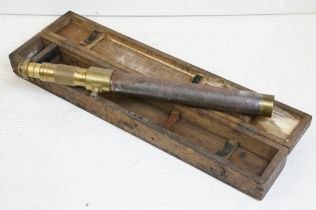 Early 20th century brass artillery gun sight, approx 74cm long, housed within a wooden case