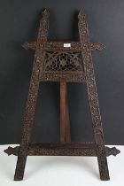 Black Forest type Display Easel with carved foliate detail, measures approx 57cm high