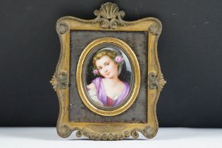 19th century porcelain plaque hand painted with a portrait of a female in a purple shawl, approx 6cm