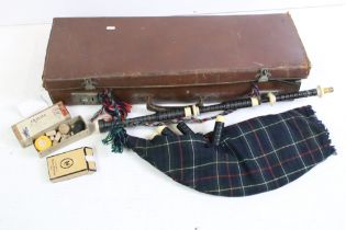 Set of Scottish bagpipes, with horn mouthpiece, turned wooden pipes and leather pipe bag with tartan