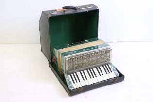 Italian Estrella twenty-four button piano accordion, cased, with two music books