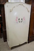 Mid century French style Cream Wardrobe, the two panel doors with applied scroll decoration and hand