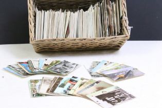 A collection of early to mid 20th century postcards to include real photo and printed examples