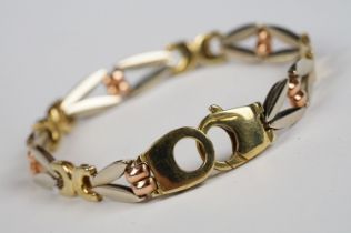 A ladies 9ct gold bracelet comprising of yellow, white and rose gold, marked 375 to the clasp