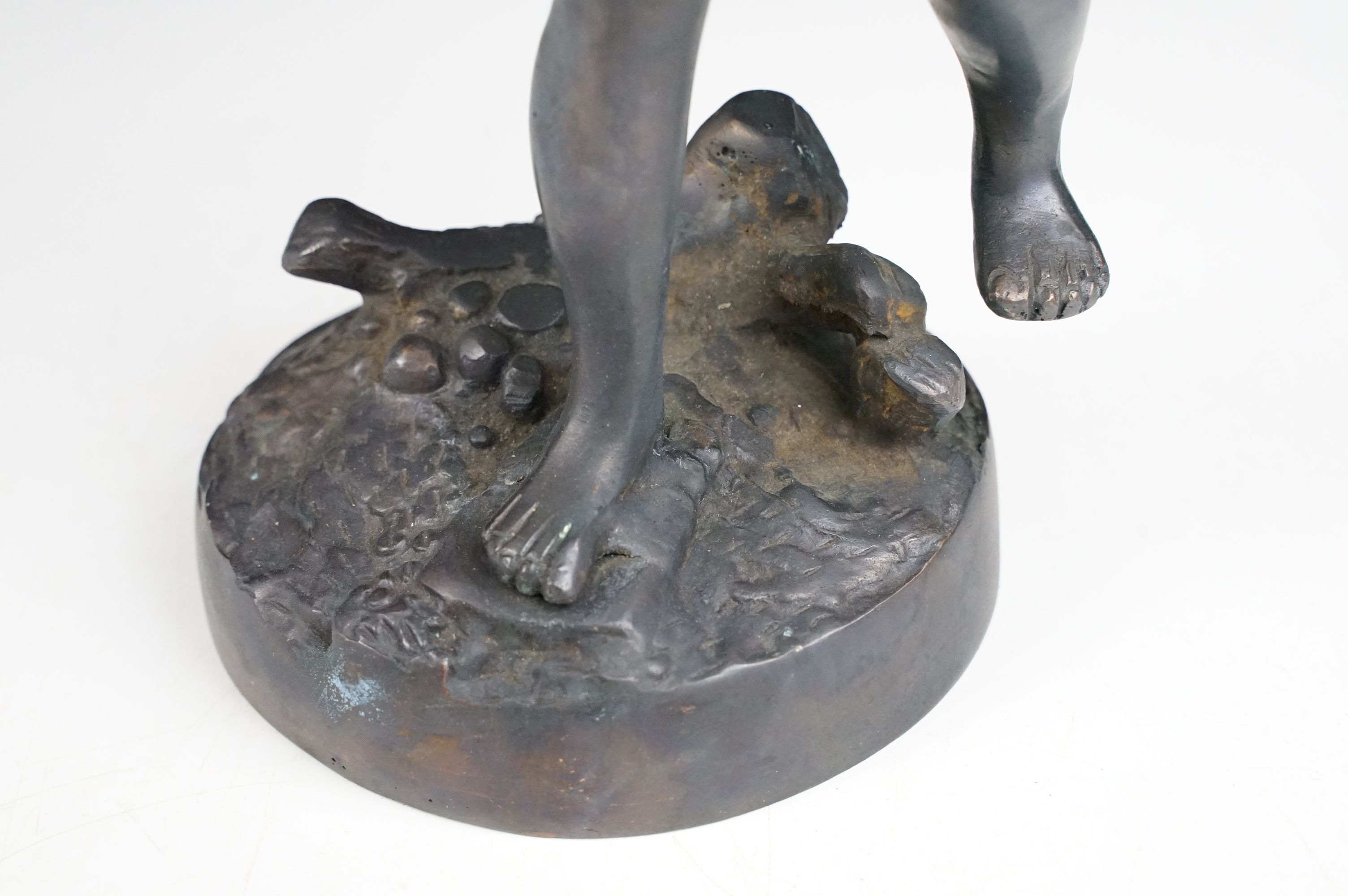 Bronze Cupid / winged cherub sculpture with loin cloth, raised on a circular base of naturalistic - Image 7 of 10