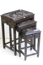 Nest of three Chinese Carved Tables, largest 41cm wide x 58cm high