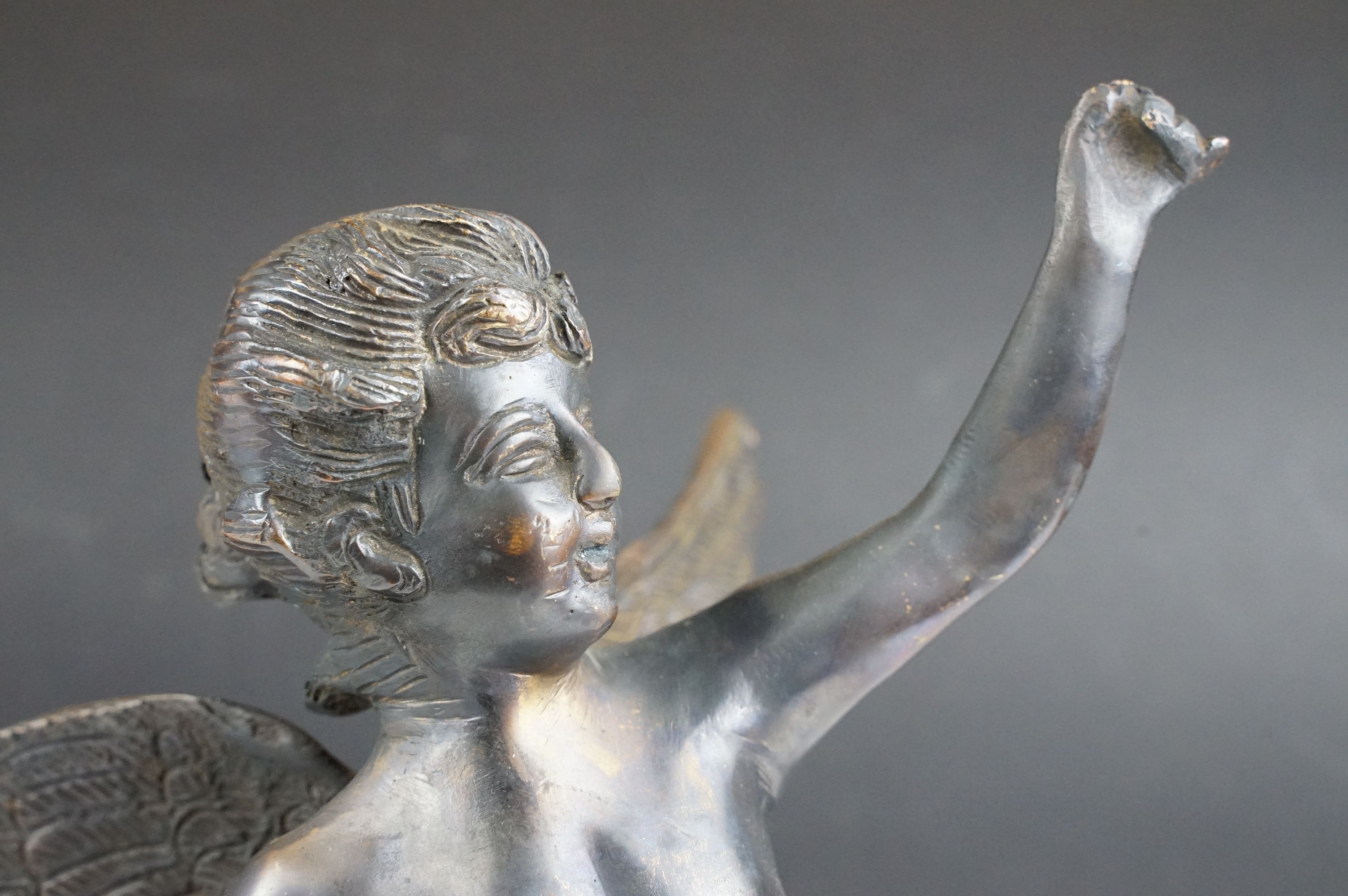 Bronze Cupid / winged cherub sculpture with loin cloth, raised on a circular base of naturalistic - Image 4 of 10
