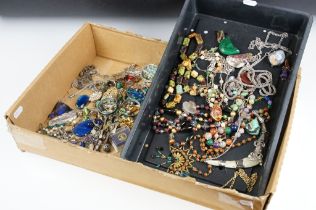A collection of mainly vintage costume jewellery contained within two trays to include bracelets,
