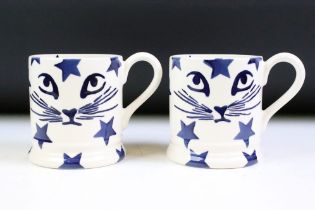 Pair of Emma Bridgewater Mugs decorated in the blue pusseycat and star pattern, 10cm high