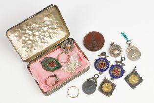 A small group of mixed collectables contained within an antique trinket box to include silver