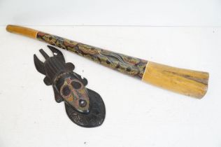 Large Australian hand painted didgeridoo together with a carved wooden African tribal mask being