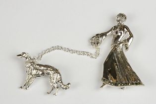 Silver Brooch in the form of an Art Deco style Lady walking a Dog